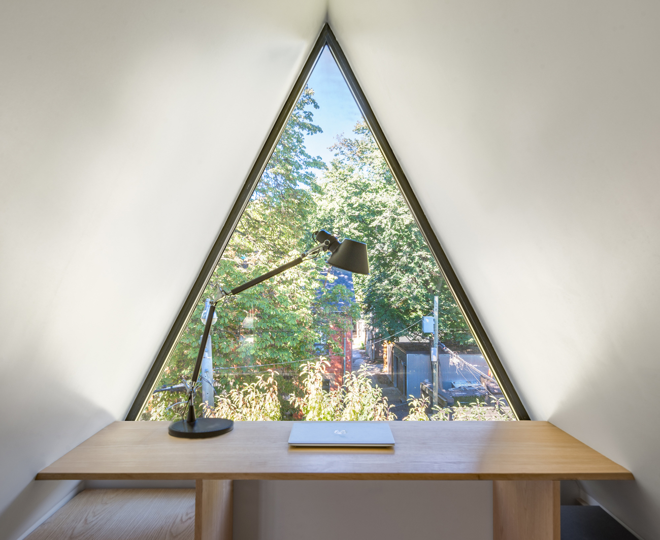 triangular window in the peak of the roof